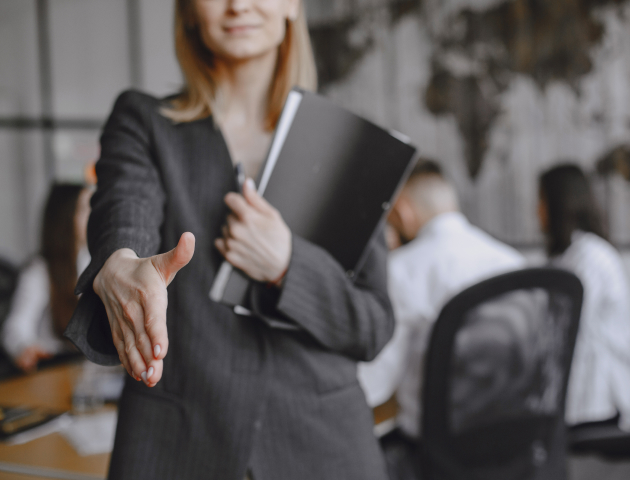 girl-signs-documents-lady-sitting-table-manager-working-office 1